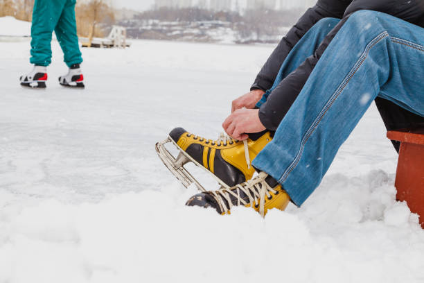 istock man ties up  shoelace on shoe boot 1200752780