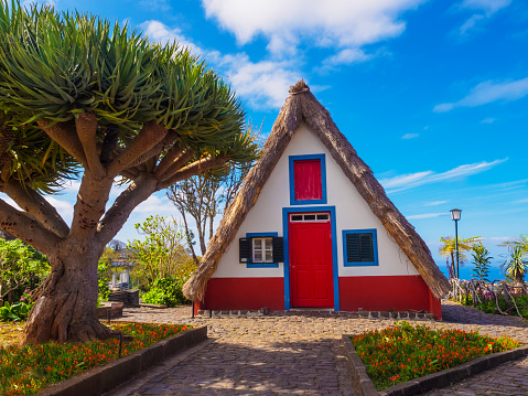 Madeira, Portugal - March 03, 2018: Traditional hut house of Santana village, rural scene of Portugal on Madeira island