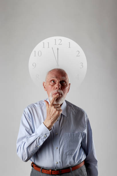 istock Old man and time. Old man is waiting. Three Minutes to Twelve. 1200754524