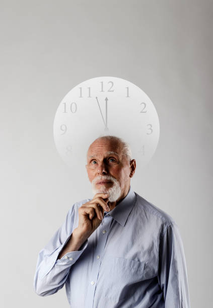 istock Old man and time. Old man is waiting. Three Minutes to Twelve. 1200754527