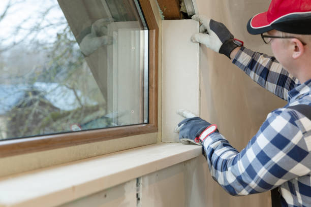 istock home improvement handyman installing window in new build attic by using leveler and laser leveler 1200756152