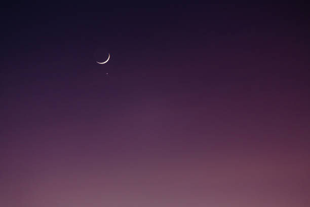 istock Moon and venus in a pink sky 1200759241
