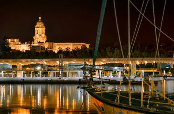 Nightshot from the harbor of Malaga, Spain, looking towards Malaga Cathedral