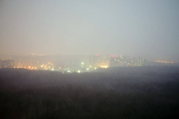 istock Blurred background with a park in a windstorm and the city, top view 1200766500