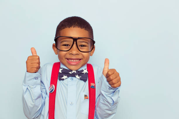 Young Boy Election Worker Gives Thumbs Up