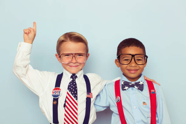 young boy voting booth workers - studio shot african descent minority looking at camera imagens e fotografias de stock