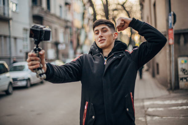 istock Teenager is vlogging on the street 1200770621