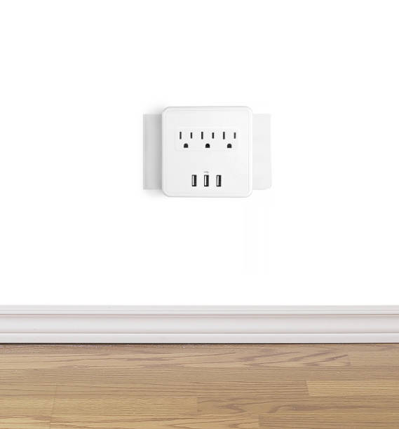 Electrical outlet wall tab with usb outlets on a wall Electrical outlet wall tab with usb outlets on a wall usb port photos stock pictures, royalty-free photos & images