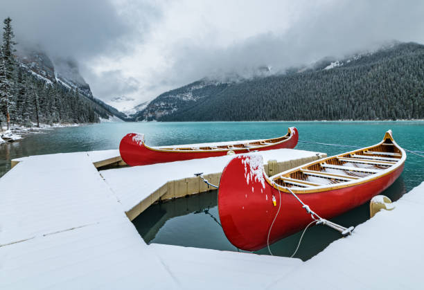 Barefoot prints across a snowy frozen lake, Jasper National Park, Jasper, Alberta, Canada