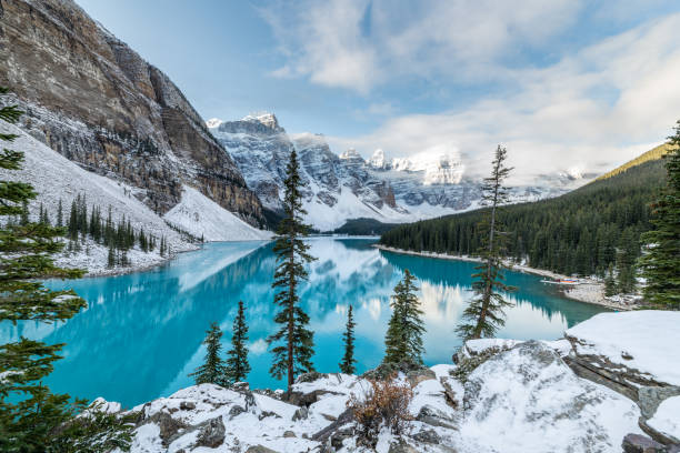 Snow on Moraine Lake Moraine Lake, Banff National Park Alberta Canada rocky mountains banff alberta mountain stock pictures, royalty-free photos & images