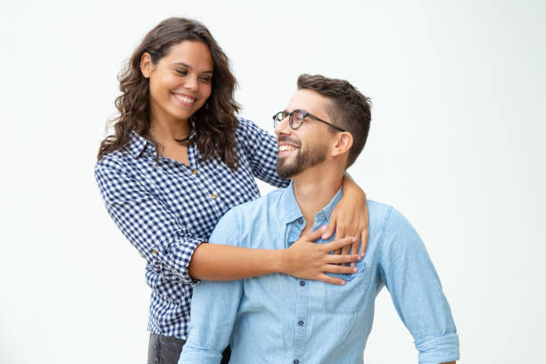 istock Happy young couple smiling each other 1200772904