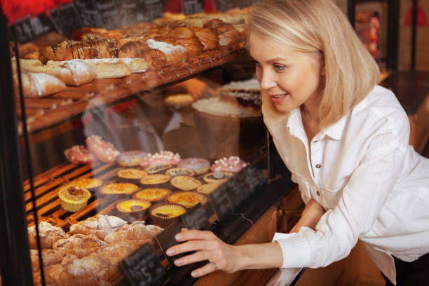 istock Young woman shopping at the bakery 1200773770