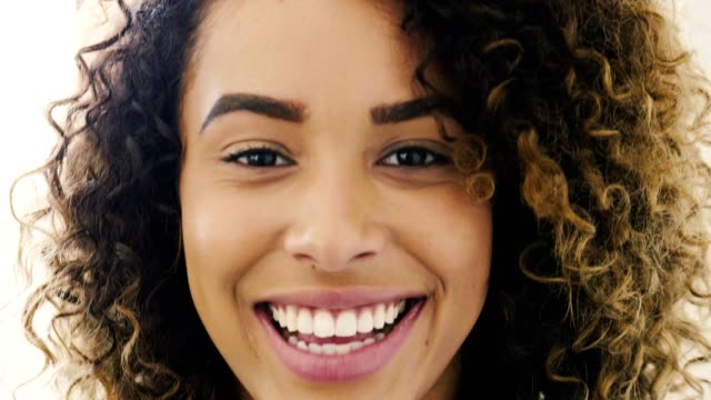 Beautiful young adult mixed race woman laughing