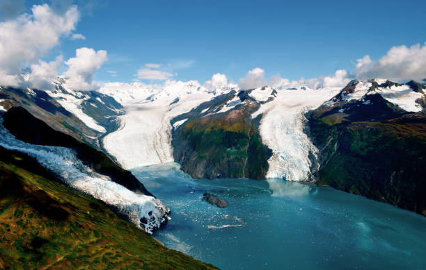 aerial shot of three majestic glaciers calving into the beautiful azure blue waters of the pacific ocean - prince of wales imagens e fotografias de stock