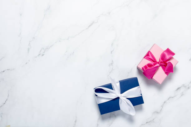 istock Gift boxes on a marble background. Holiday concept, presents. Flat lay, top view 1200774072