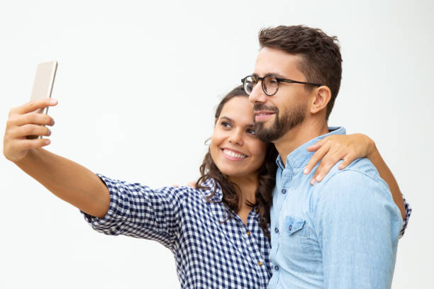 istock Happy couple taking selfie with smartphone 1200774220