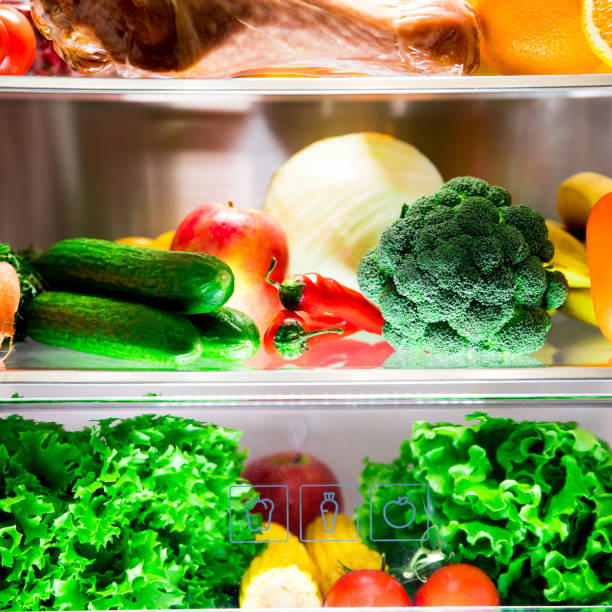 Open fridge. Healthy food. Vegetables and fruits stock photo