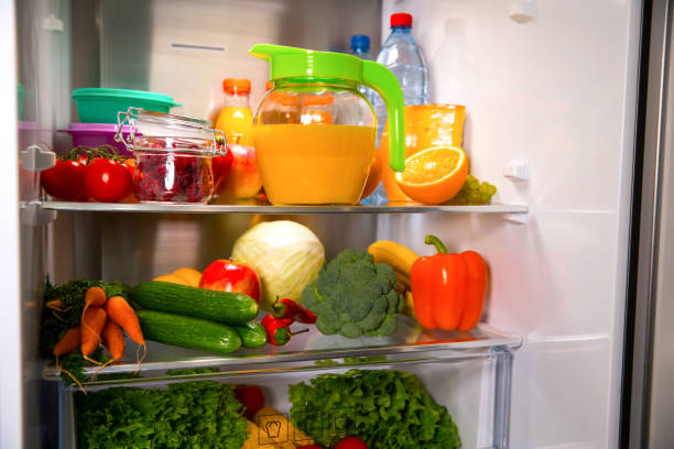 Open fridge. Healthy food. Vegetables and fruits stock photo