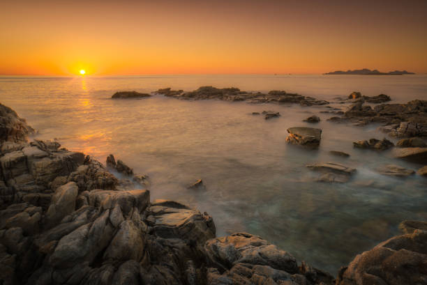 Enjoying the last moment of Sun over the horizon during a hot day of Summer.