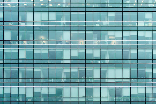 istock Glass facade texture of a modern office building. High tech architecture. Elements of urban design. Windows of skyscraper tower. 1200776806