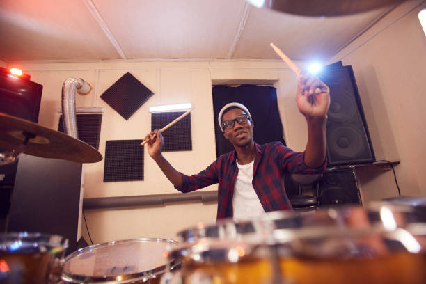 istock Portrait of African Man Playing Drums 1200778893