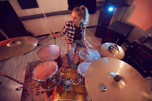istock Young Woman Rocking Drums 1200779093