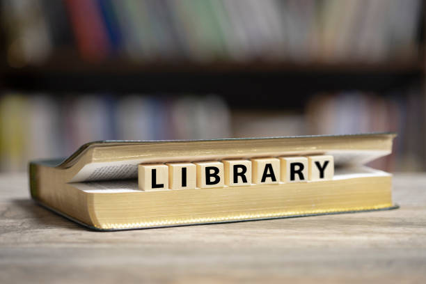 istock Book on desk with Library word 1200780380