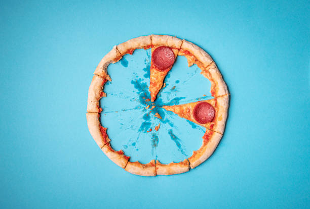 istock Pizza salami and crust leftovers. Last two pizza pepperoni slices 1200783781