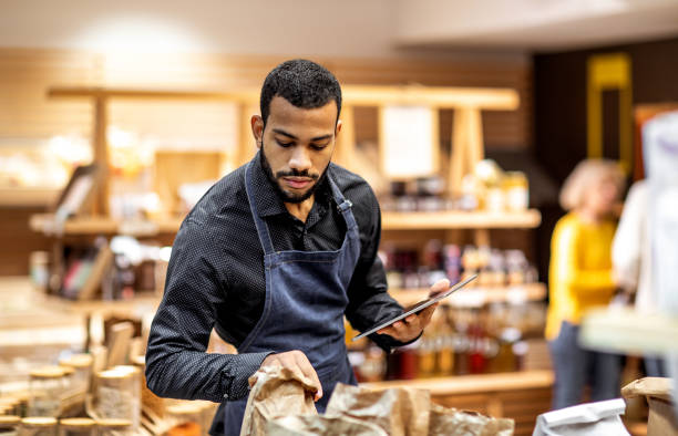 istock Employee working at the bio grocery shop 1200784989