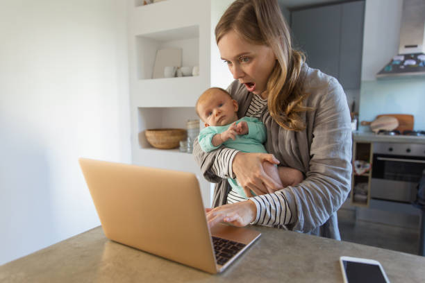 istock Concerned new mom holding baby 1200787036