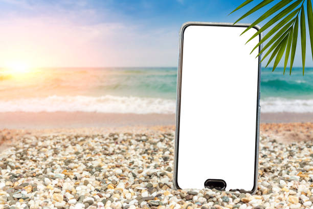 istock Pattern for text. Phone on the beach by the sea. 1200790245
