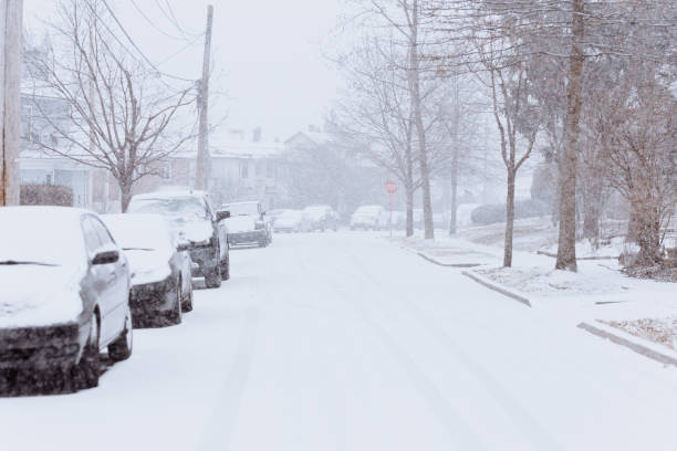 istock Car covered by snow on the street 1200790970