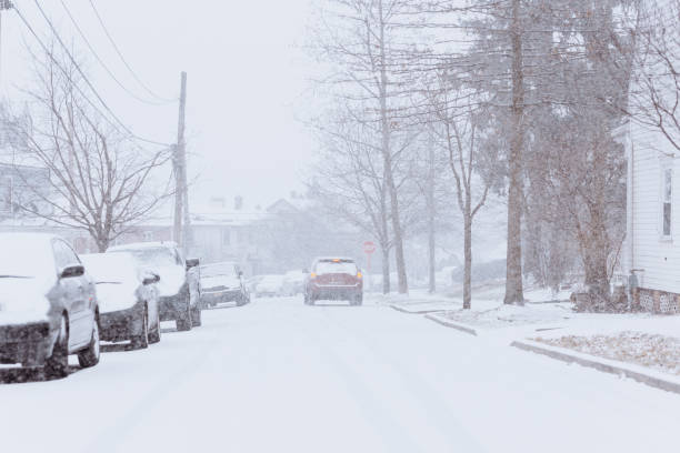 istock Cars driving through snowy weather 1200791042