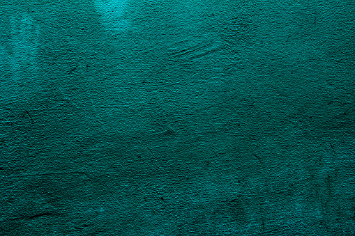 Petrol colored background with textures of different shades of petrol also called teal