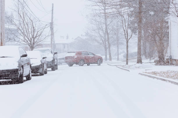 istock Cars driving through snowy weather 1200791083