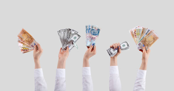 istock many hands up holding money 1200792966