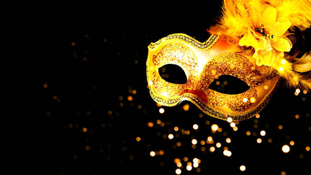 istock Golden Carnival mask on black background. Mardi Gras concept. Copy space 1200796429