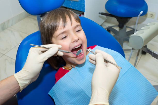 istock Child having teeth examined at dentists 1200798316