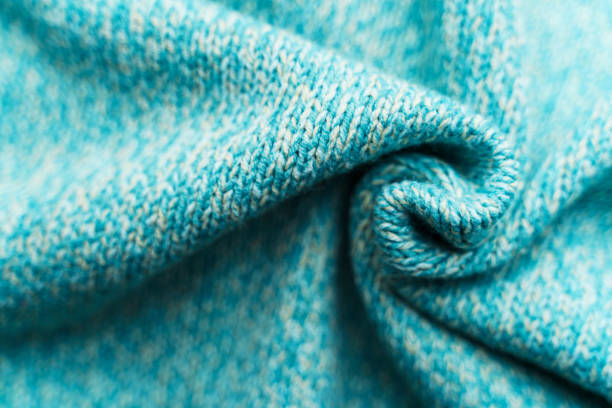 istock Crumpled texture of a blue turquoise knitted fabric 1200799172