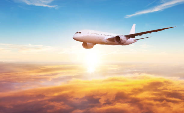 istock Passengers commercial airplane flying above clouds 1200799436