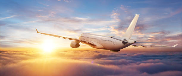 istock Passengers commercial airplane flying above clouds 1200799485