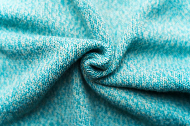 istock Crumpled texture of a blue turquoise knitted fabric 1200799488