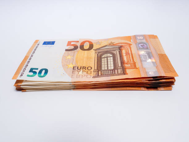 istock A bundle of fifty euro bills on white background 1200800979
