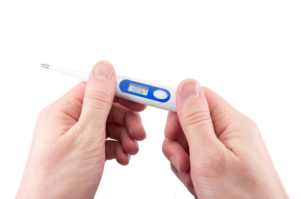 istock electronic thermometer in hand shows high temperature, fever 1200802098
