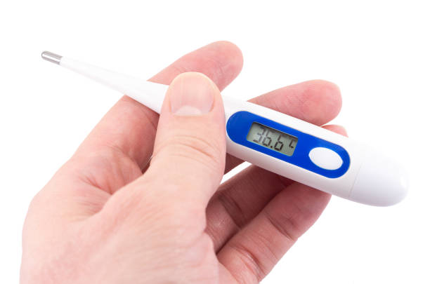 istock electronic thermometer in hand shows high temperature, fever 1200802114