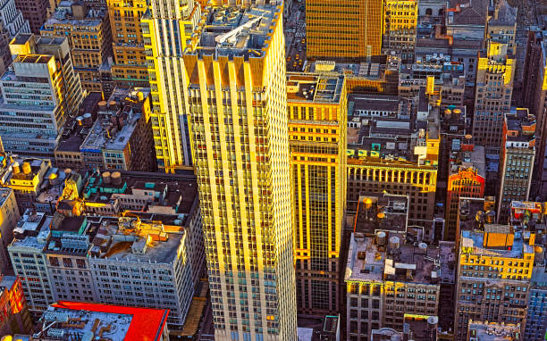 istock Aerial view from Empire State Building on Skyscrapers at sunset reflex 1200802972