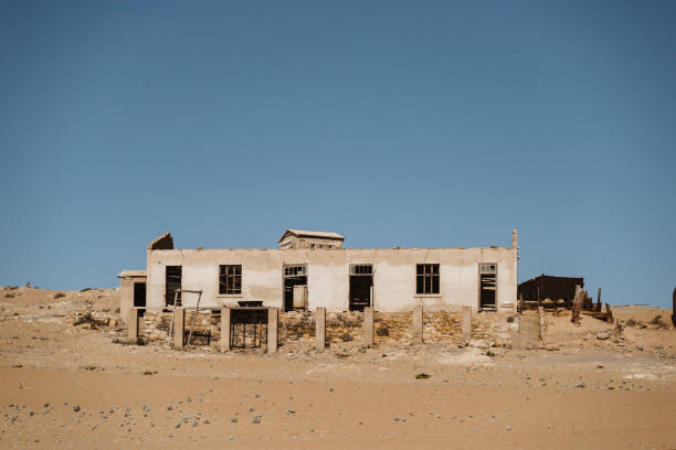 istock home ruins in the African desert sunk in sand 1200803400