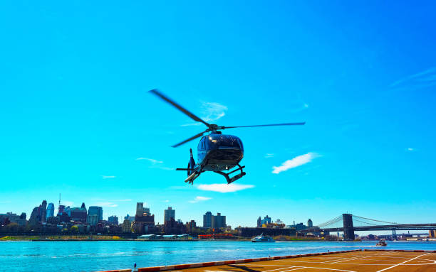 istock Helicopter and Brooklyn bridge and Manhattan bridge over East River reflex 1200804127