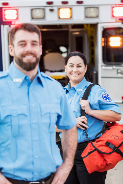 istock Paramedics standing at the rear doors of an ambulance 1200805073