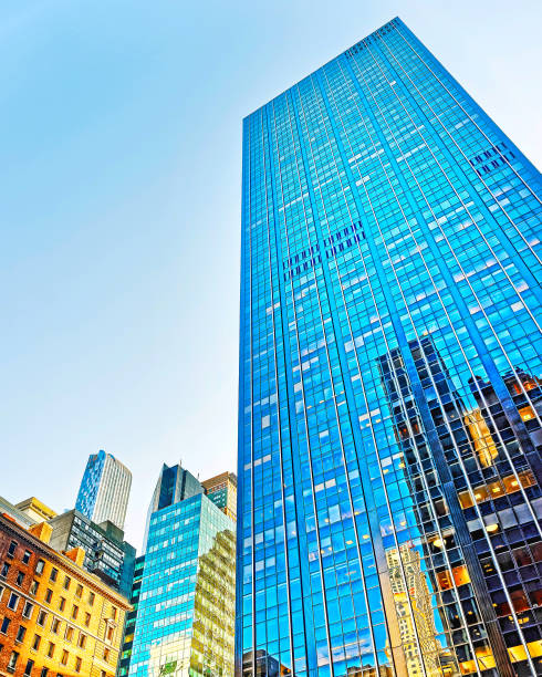 istock Bottom up view on Manhattan Skyscrapers with reflection reflex 1200805882
